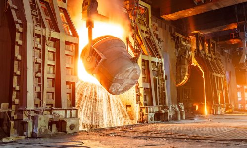 Cement production factory on mining quarry. Conveyor belt of heavy machinery loads stones and gravel