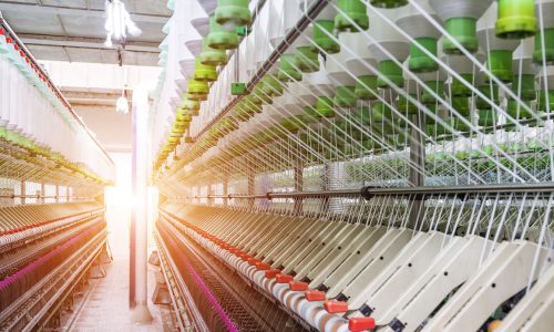 Cement production factory on mining quarry. Conveyor belt of heavy machinery loads stones and gravel